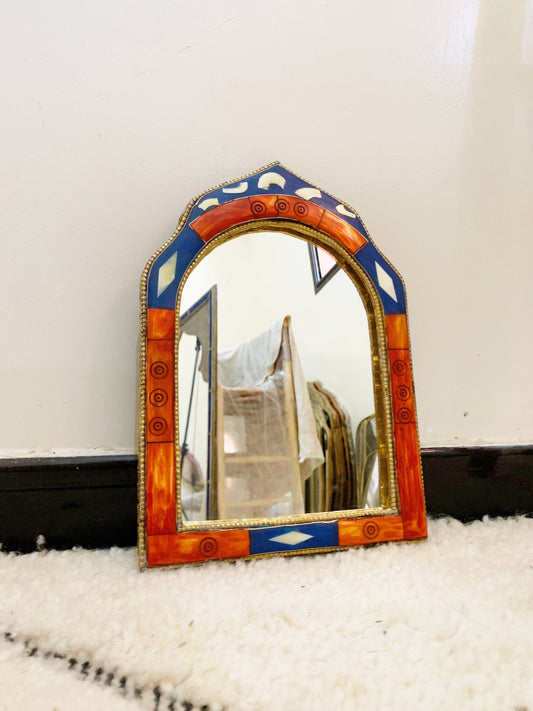 a mirror sitting on top of a white rug