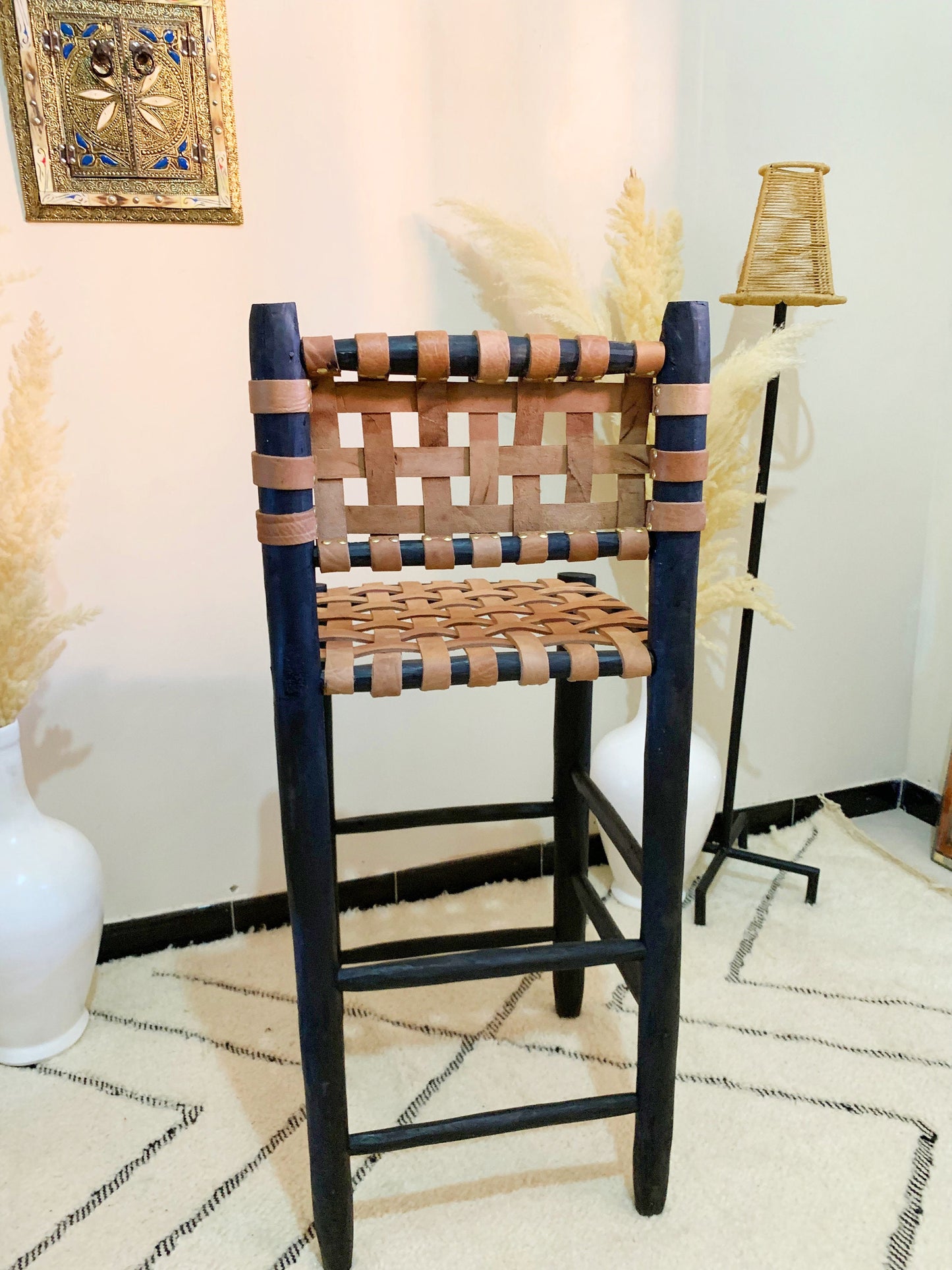 a wooden chair with a woven seat and back