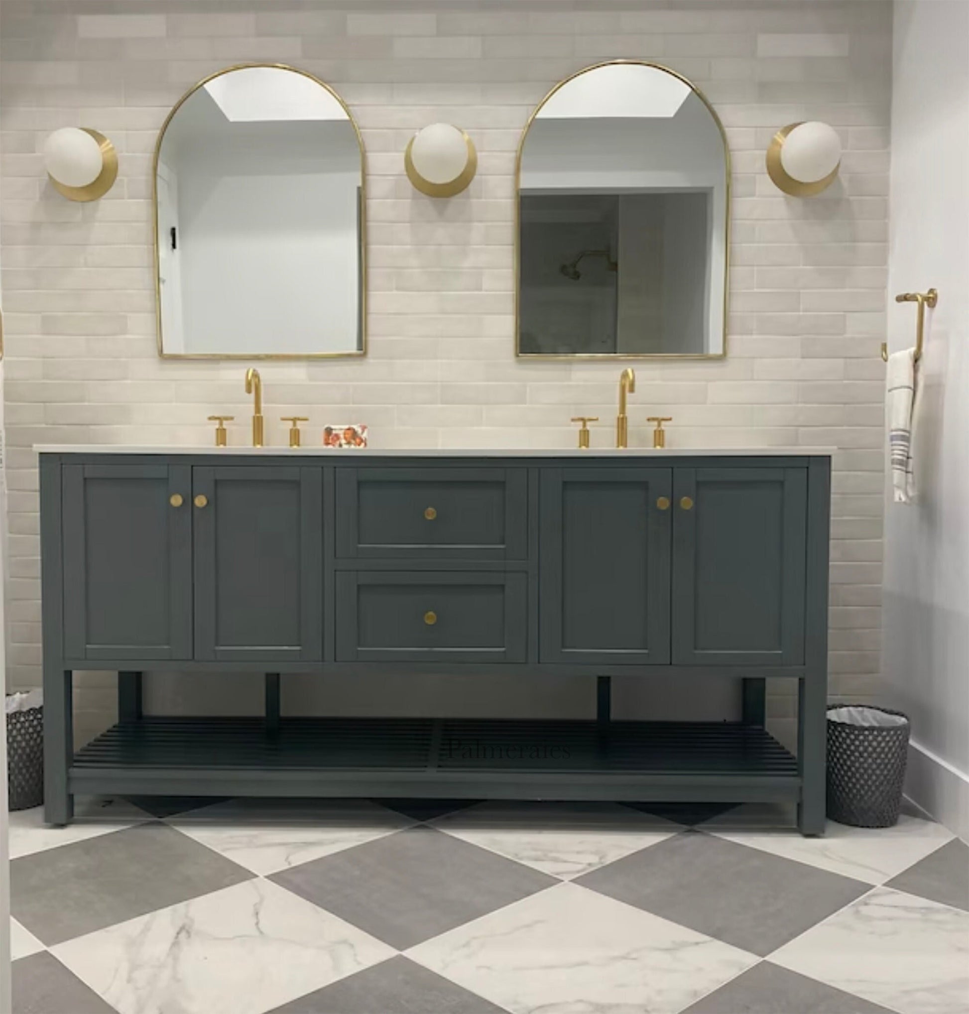 a bathroom with two mirrors and two sinks