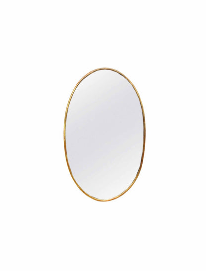 an oval mirror on a white wall