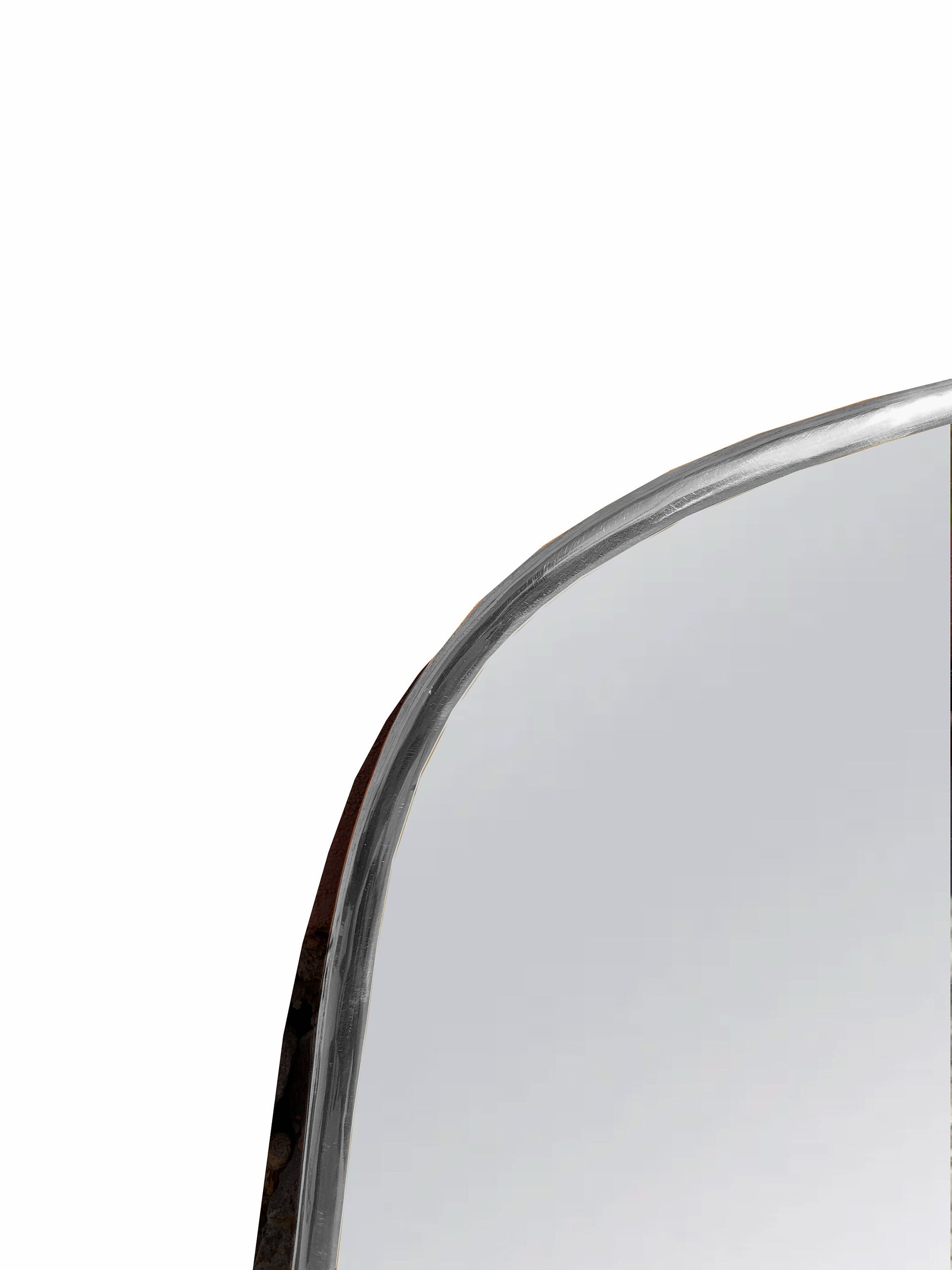 a close up of a mirror on a white background