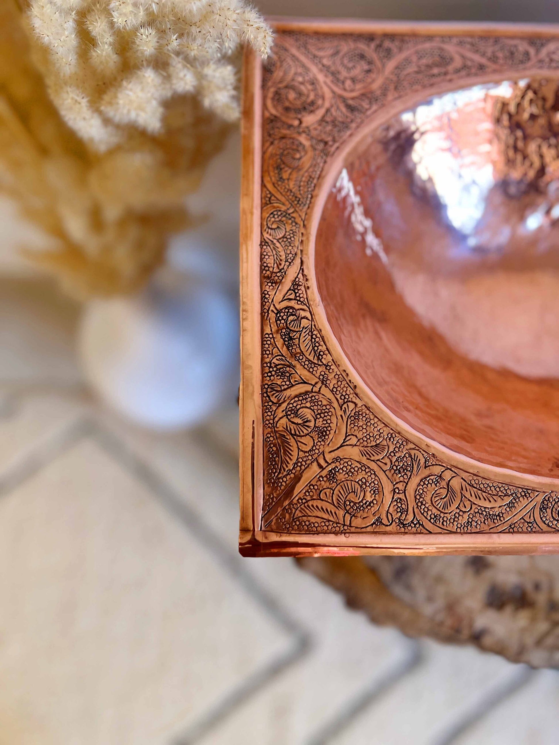 a wooden bowl sitting on top of a table