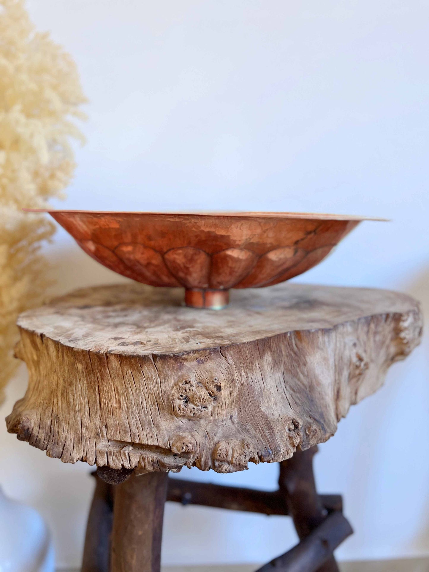 a wooden table with a bowl on top of it