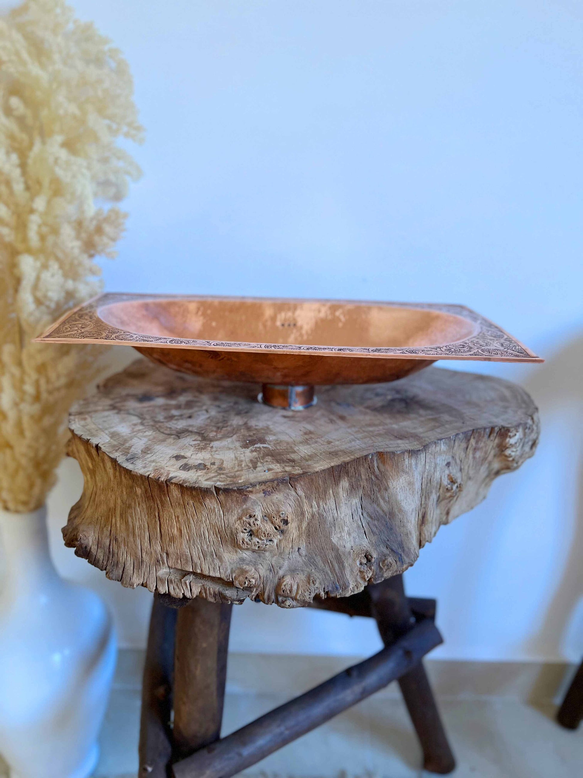 a wooden table with a bowl on top of it