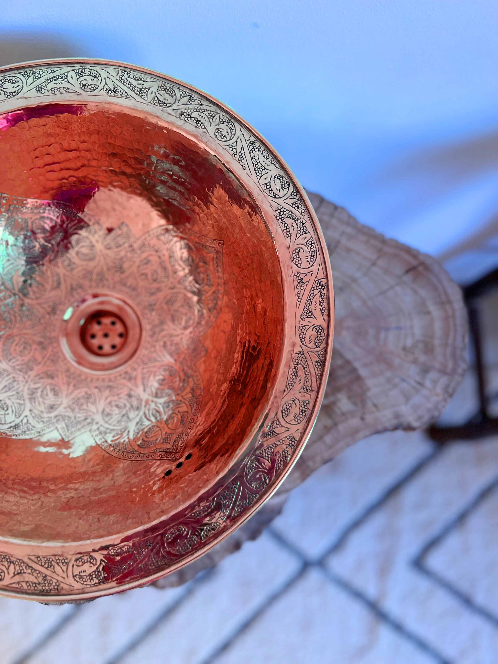 a close up of a metal bowl on a table