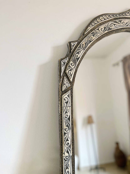 a mirror that is on a wall in a room