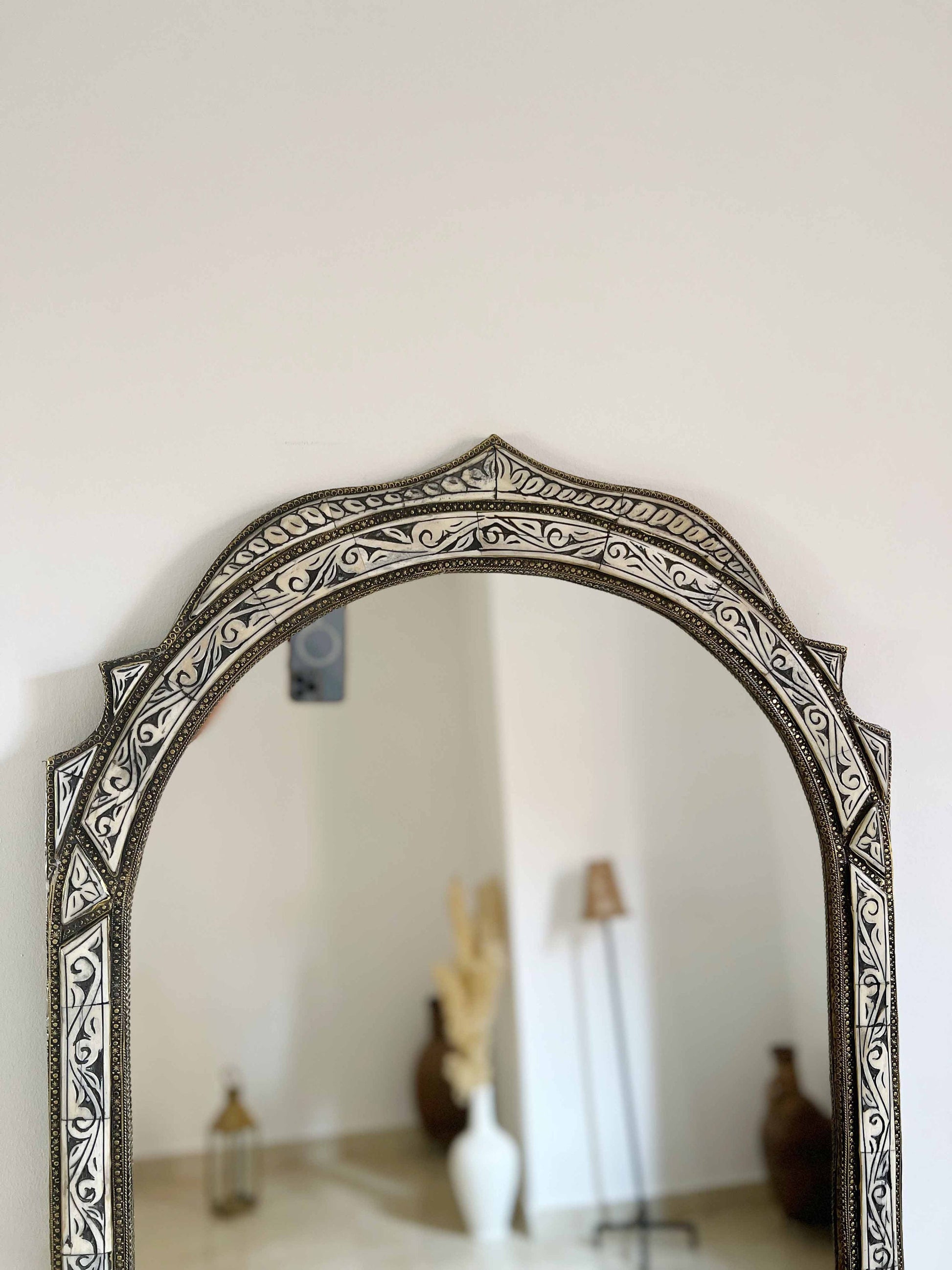 a mirror that is on the wall in a room