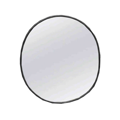 a round mirror on a white wall