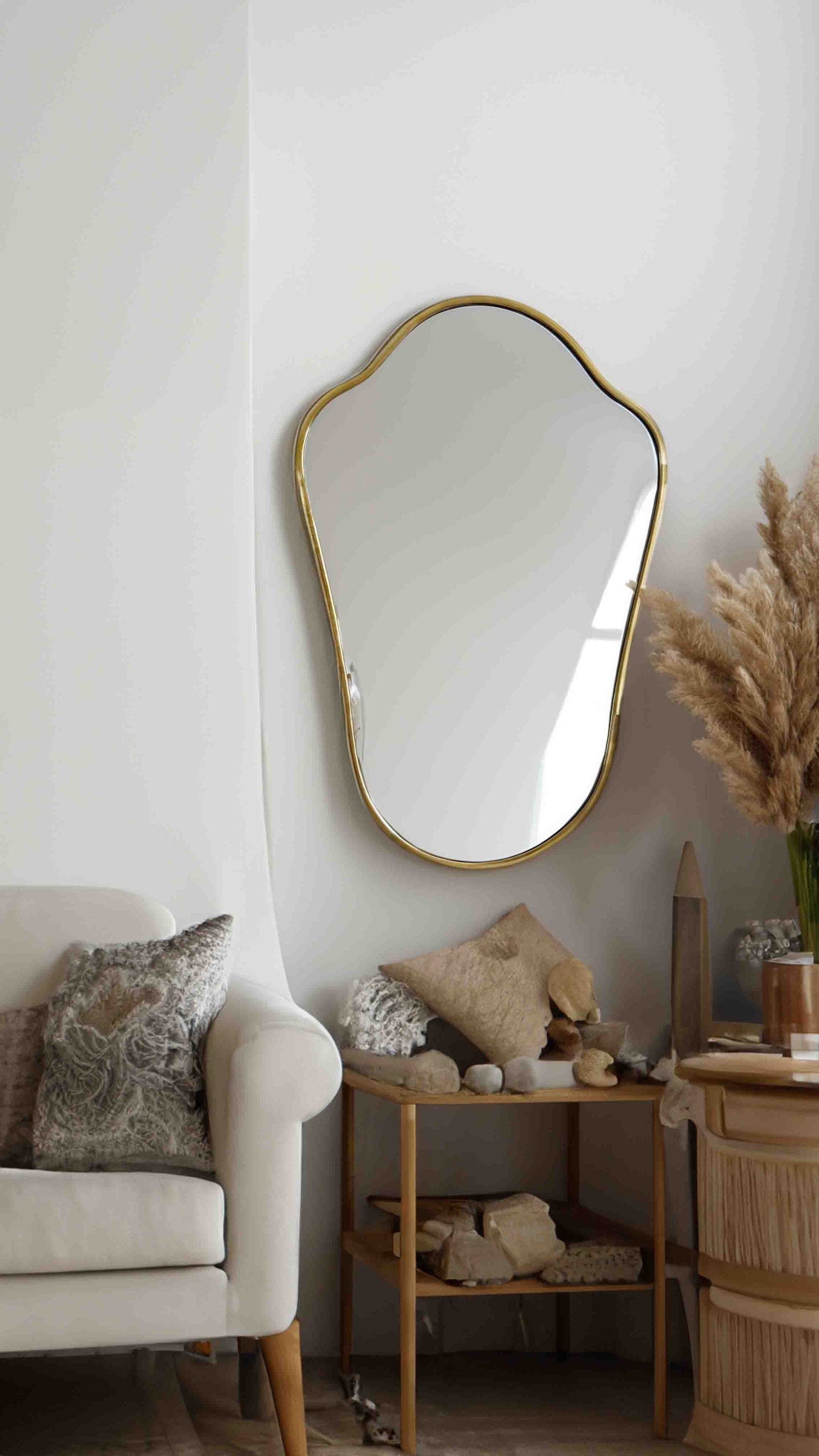 a living room with a couch and a mirror