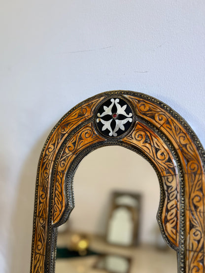 a mirror that has a clock on it