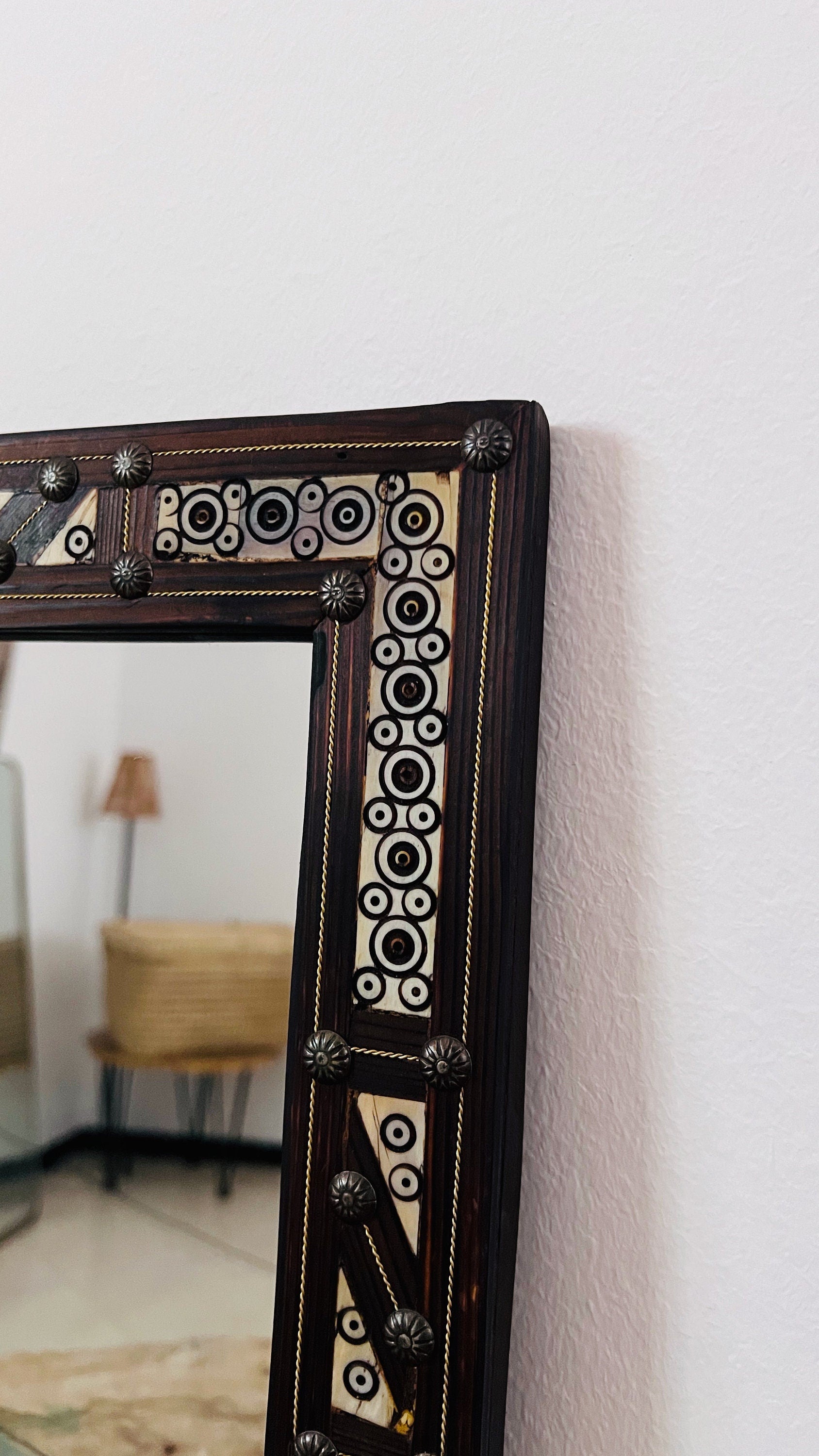 a mirror that is sitting on a wall